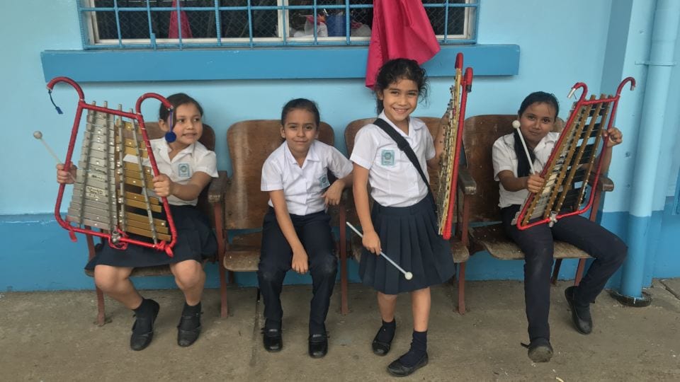 Tamia Beckles kids with xylophones under window